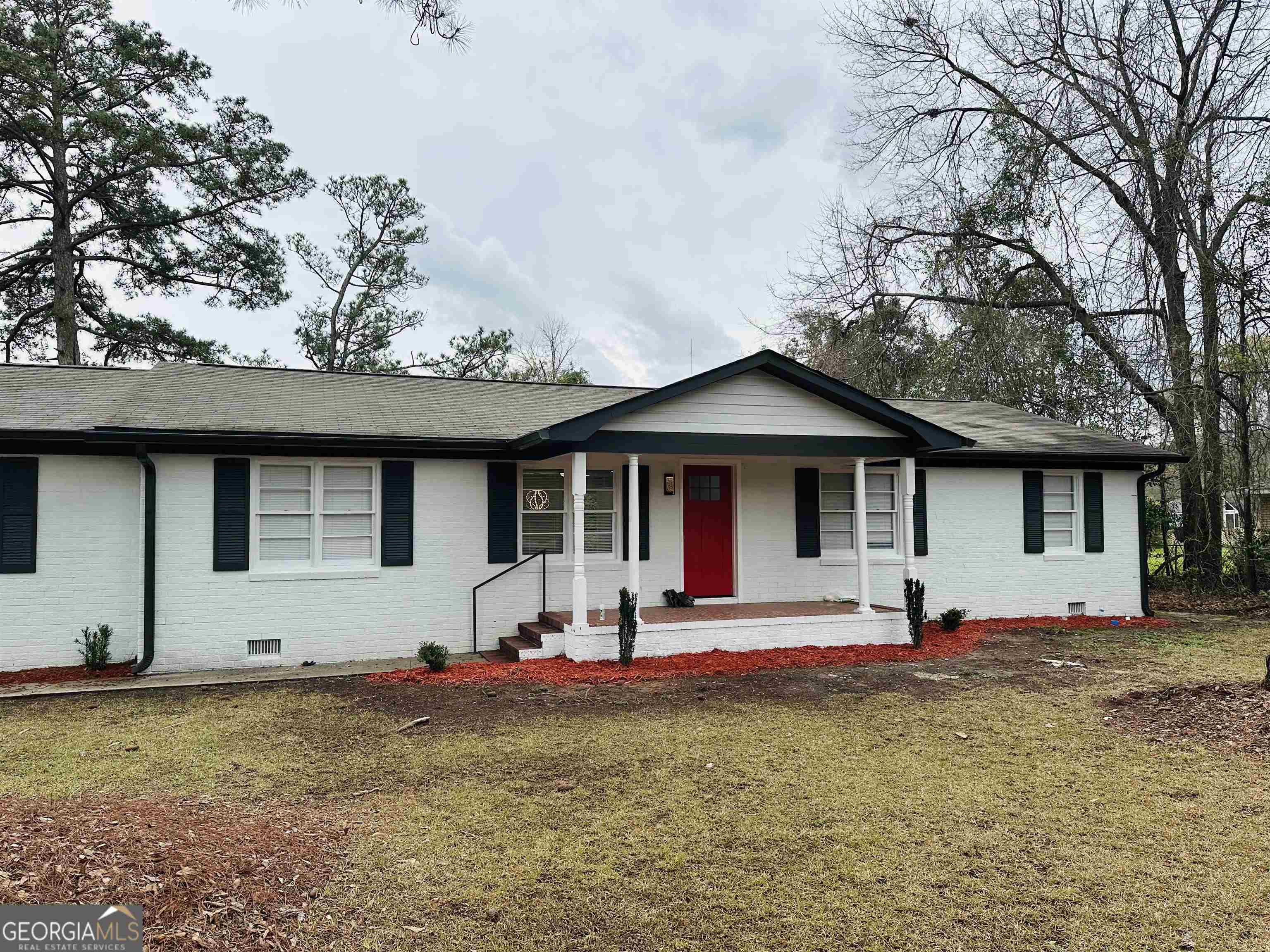 a front view of a house with a yard