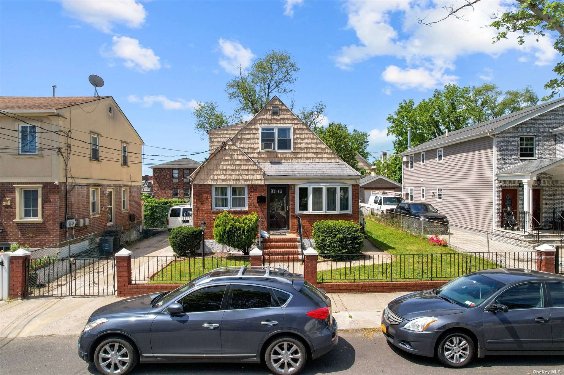 a front view of a house with parking space