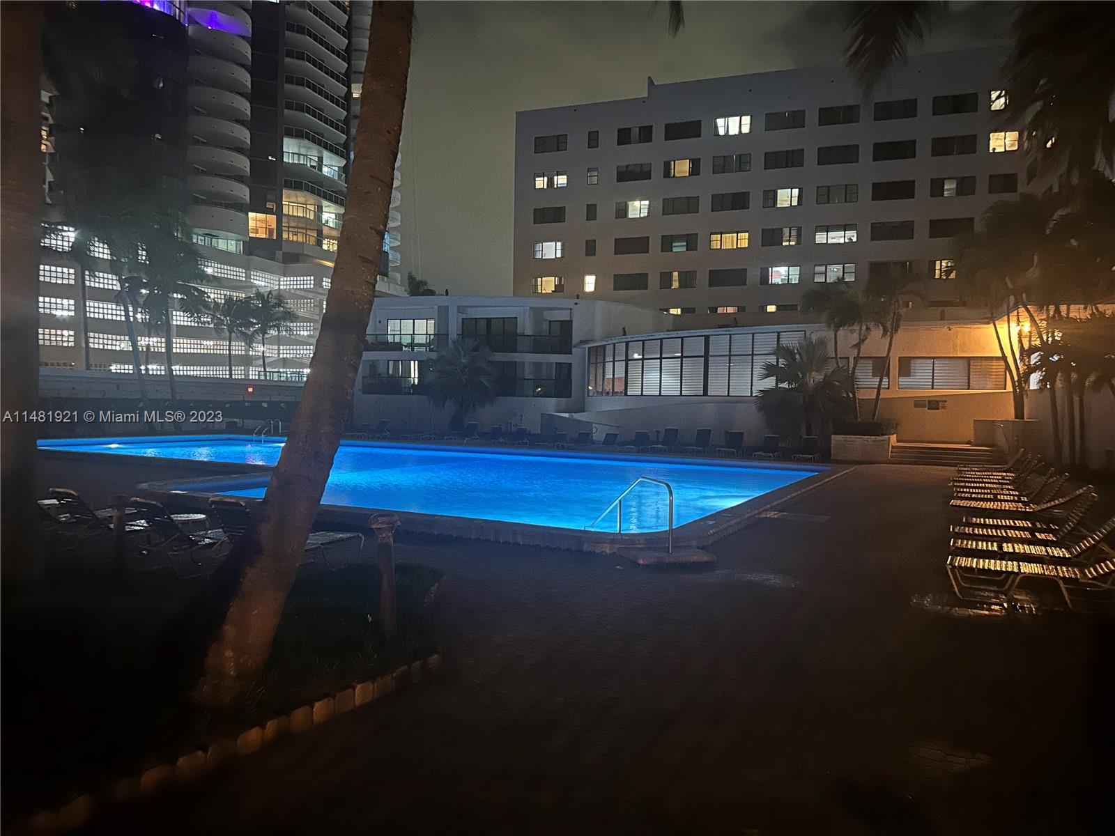 a swimming pool view with a outdoor space