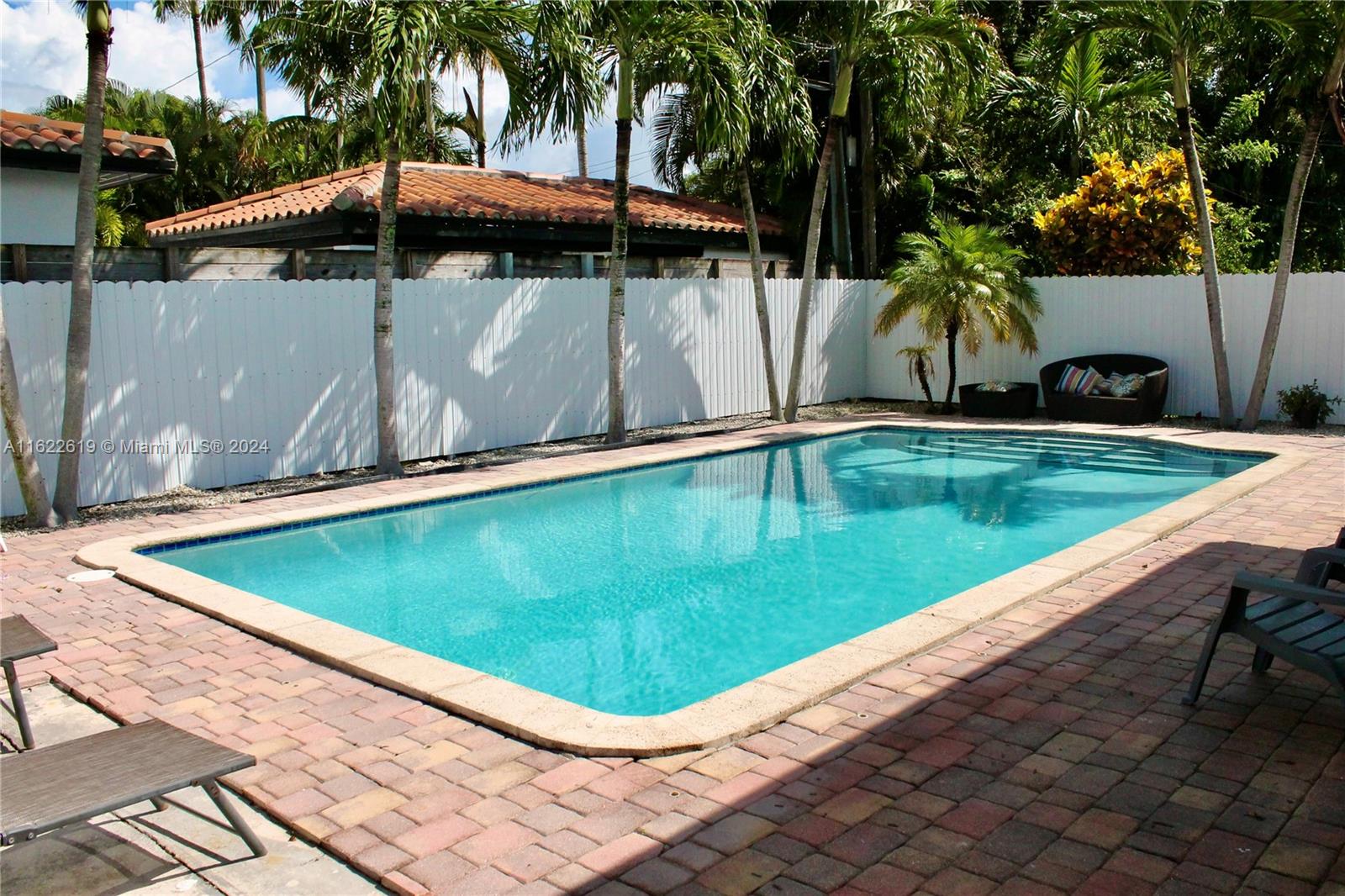 a view of a swimming pool with a patio