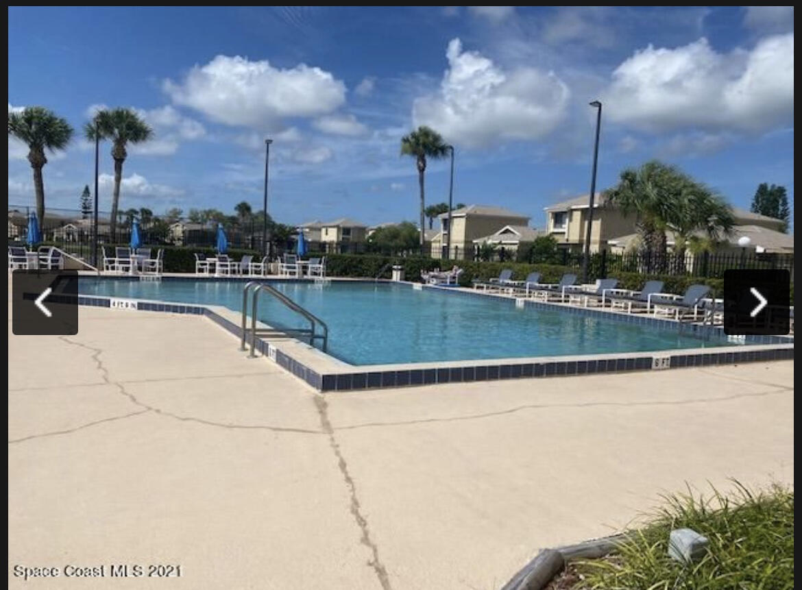 a view of a swimming pool and a tables