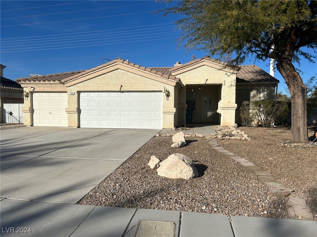 Front View of this One Story Home with 3 Car Garag