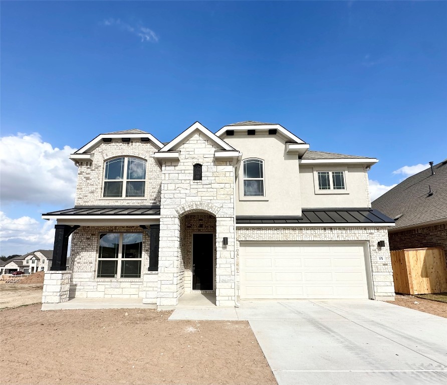 a front view of a house with a garage