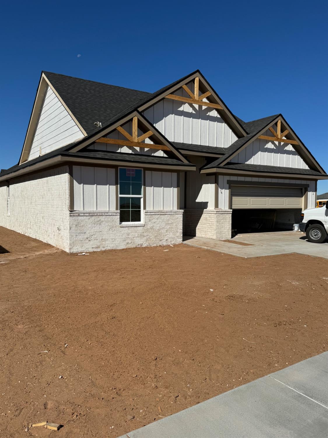 a front view of a house with a garage