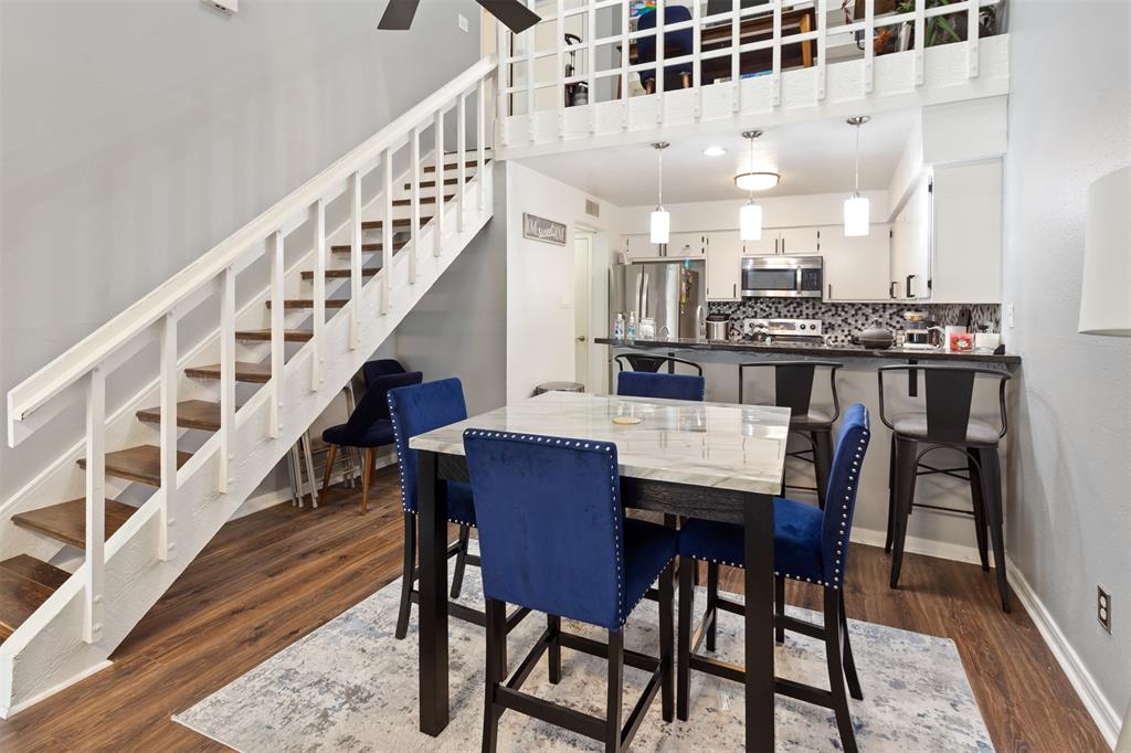 a dining room with furniture and entryway