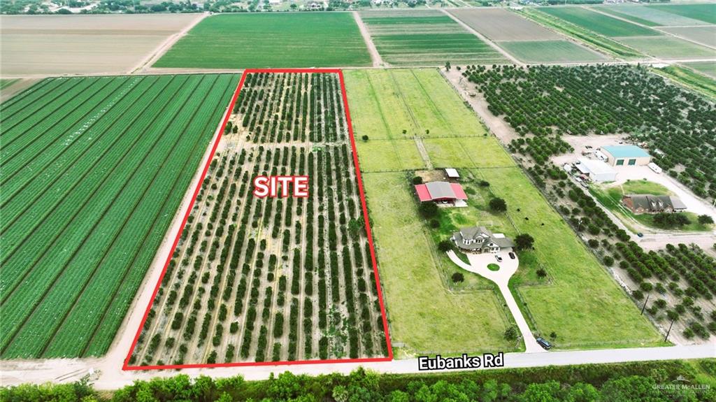 Birds eye view of property featuring a rural view