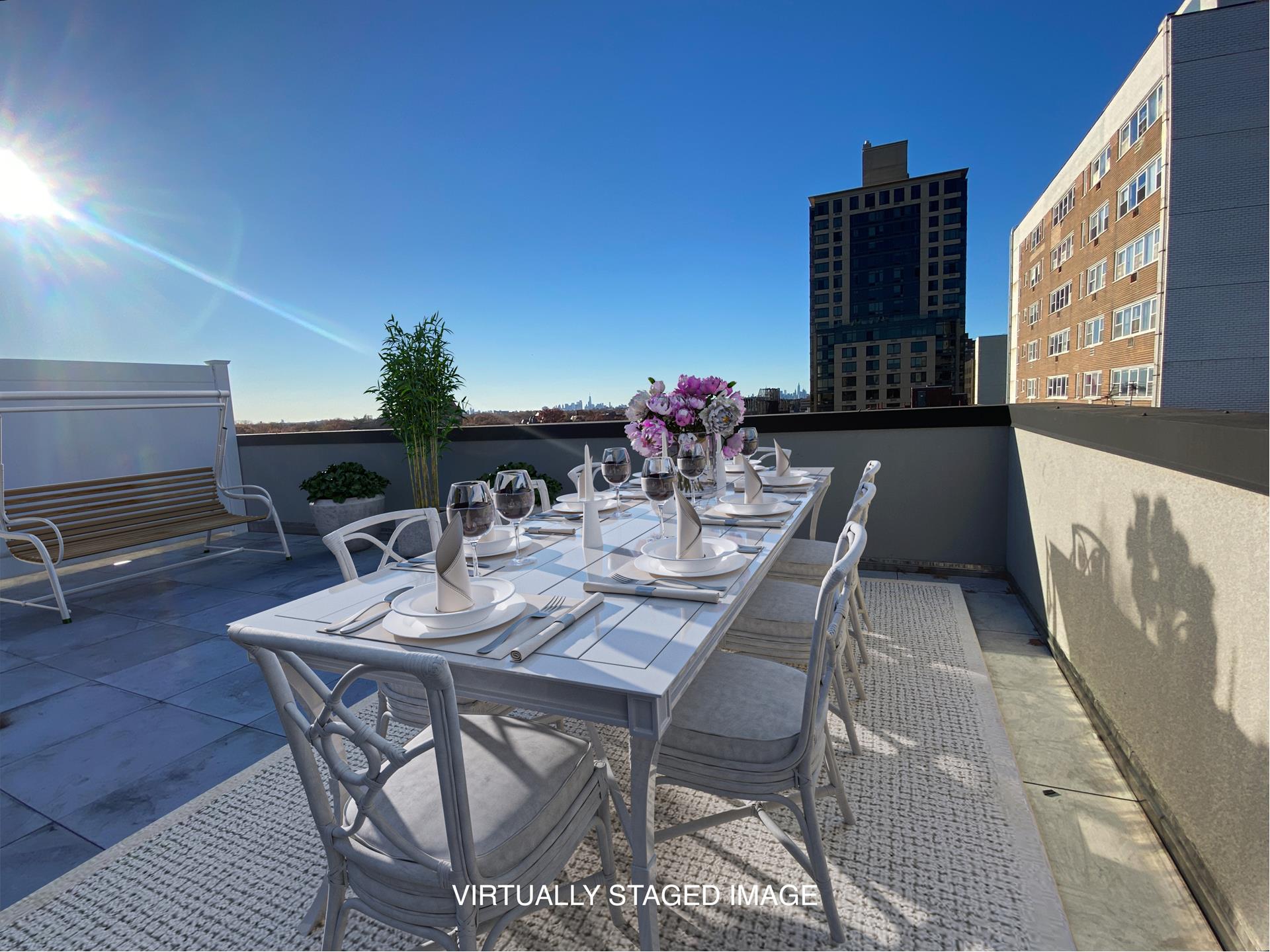 a view of an outside dining space with furniture