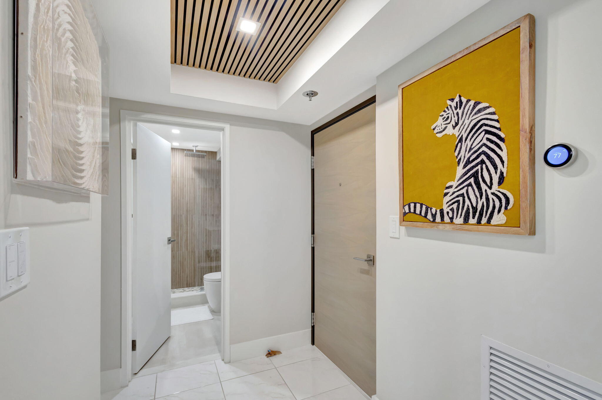 a view of a bathroom with a door and a shower