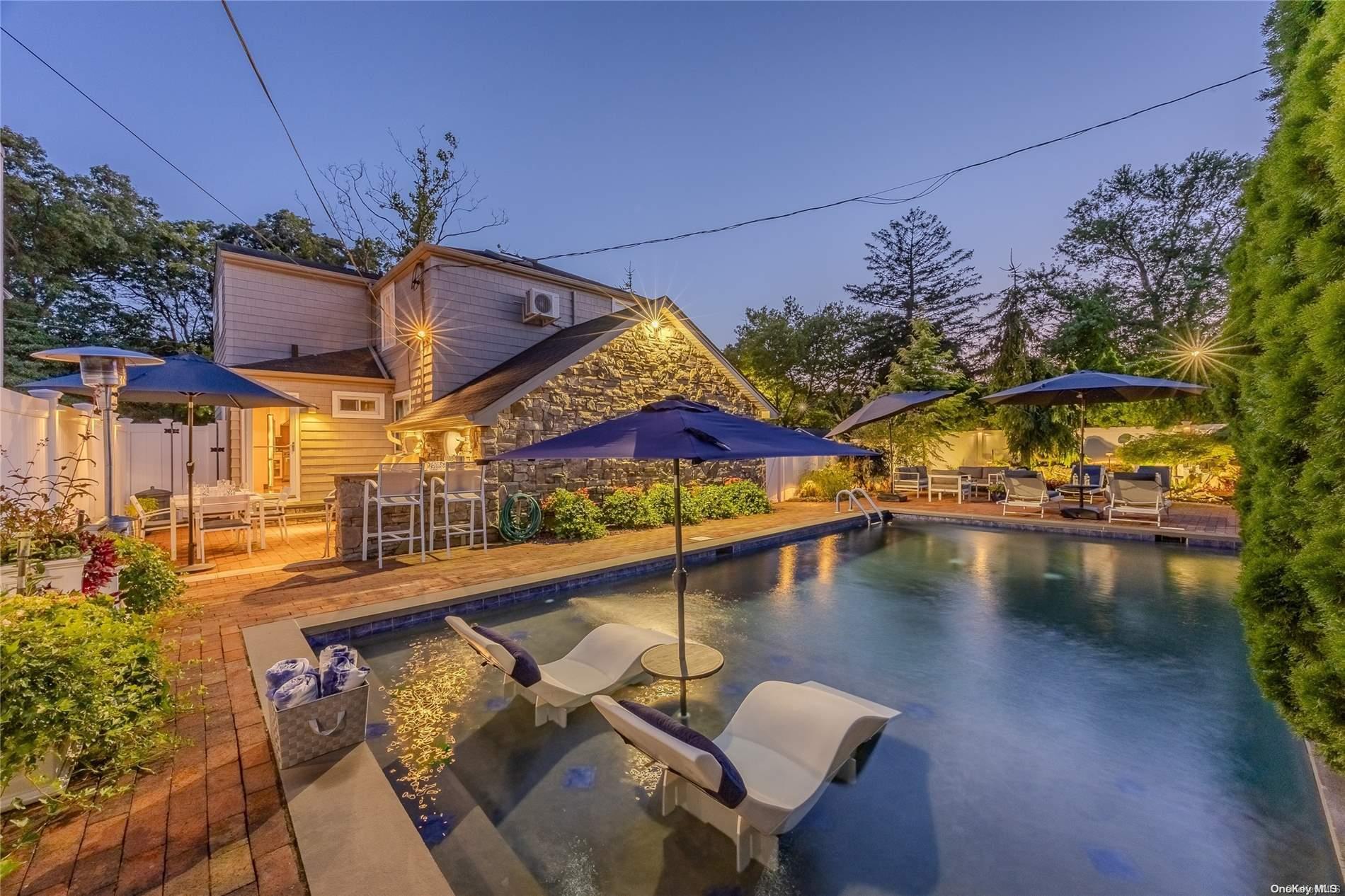 a view of a swimming pool with a patio