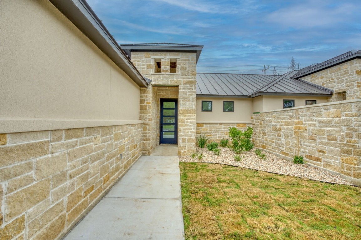 a view of front door of house with an outdoor space