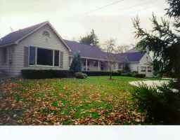 a view of house with garden