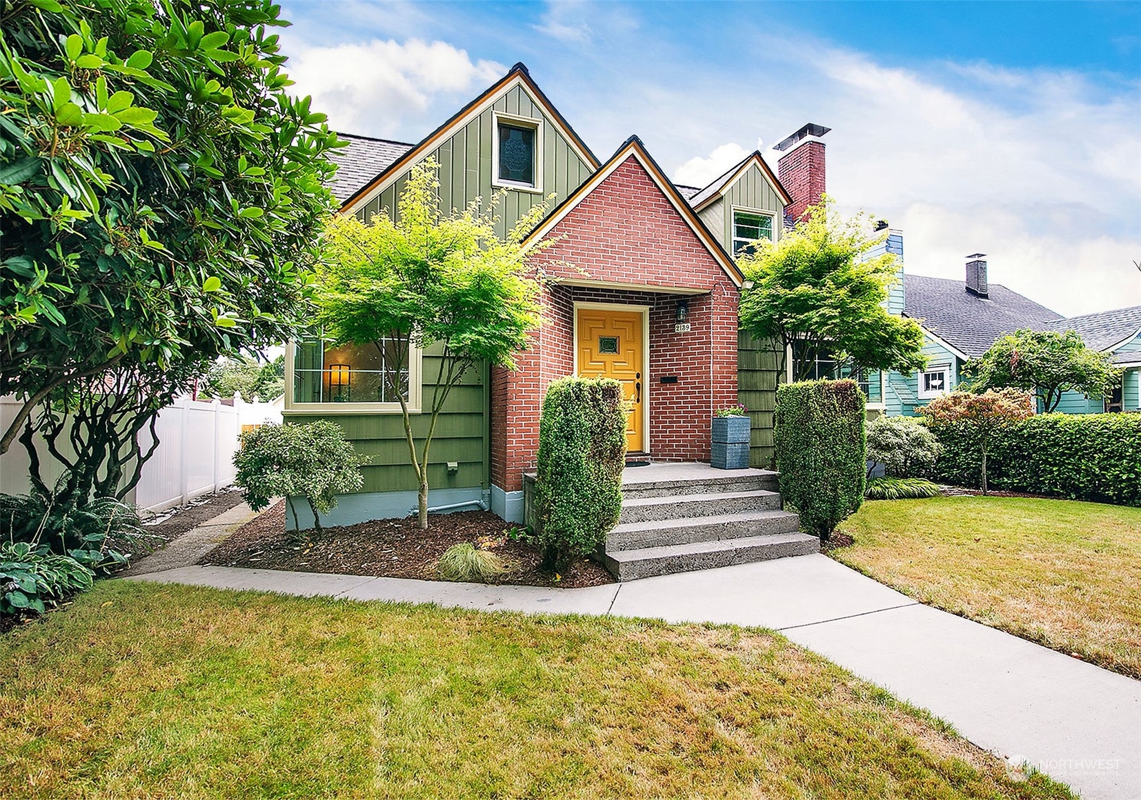 a front view of a house with garden