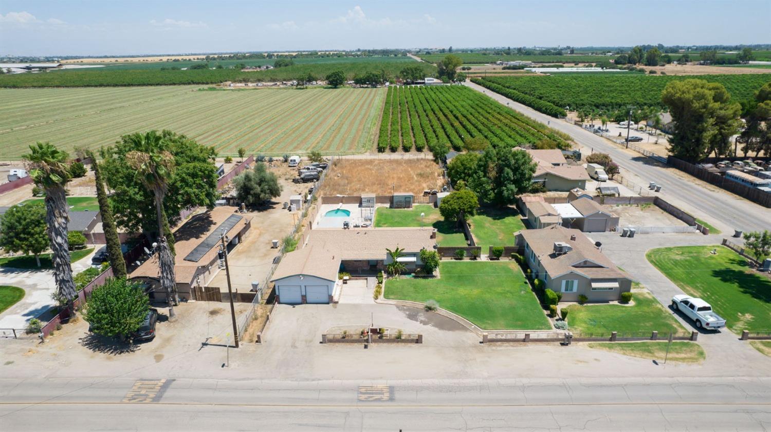 an aerial view of a house with outdoor space and lake view