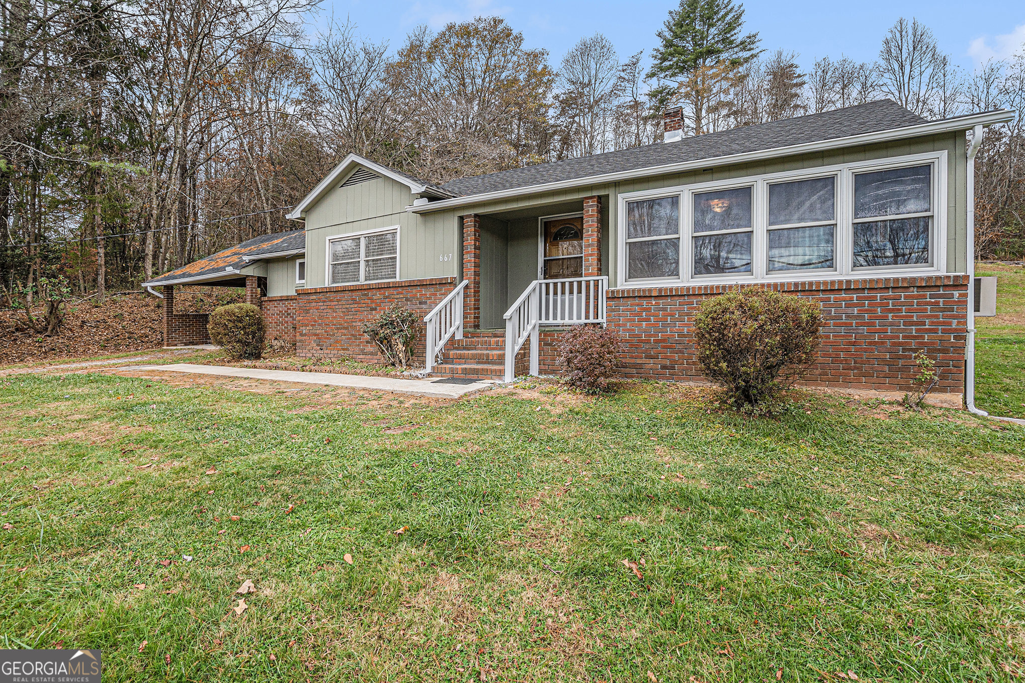 a front view of a house with a yard