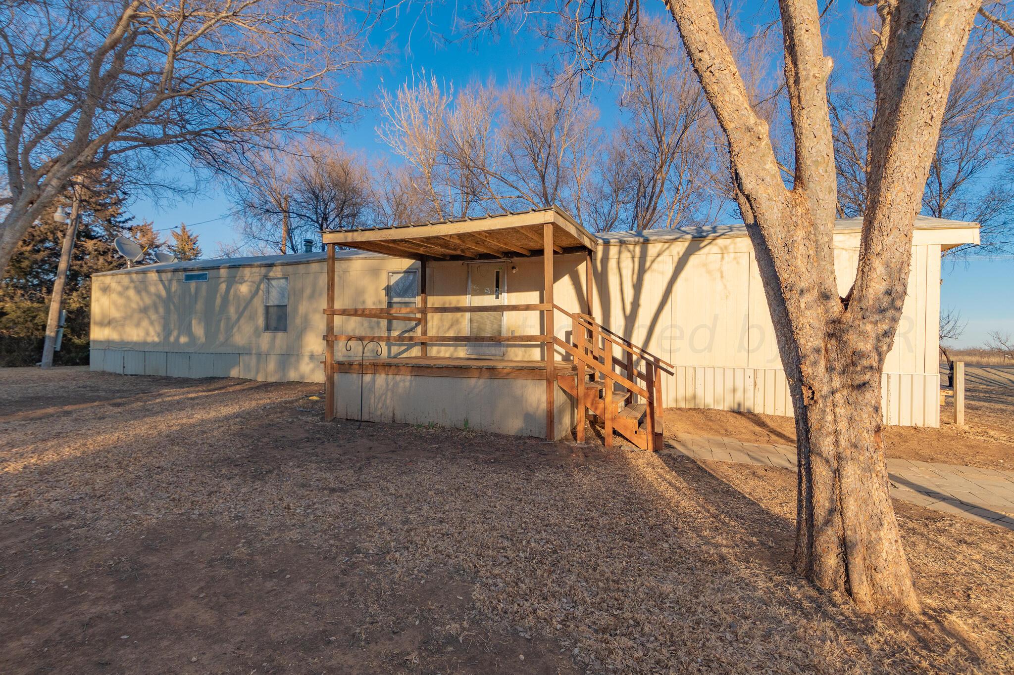 a view of a backyard of the house