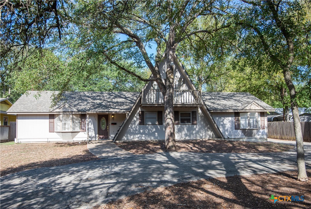 a view of a house with a trees