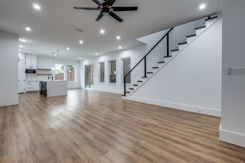 a view of kitchen with cabinets and wooden floor