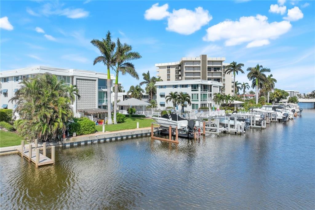 View of water feature with a boat dock