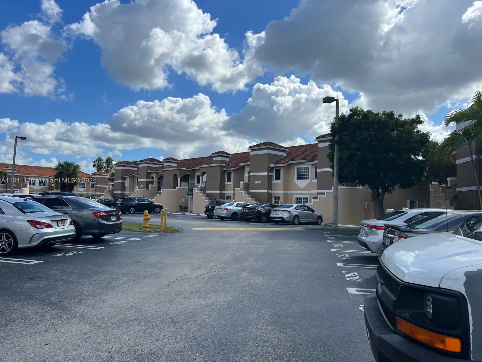 a view of a car park in front of house