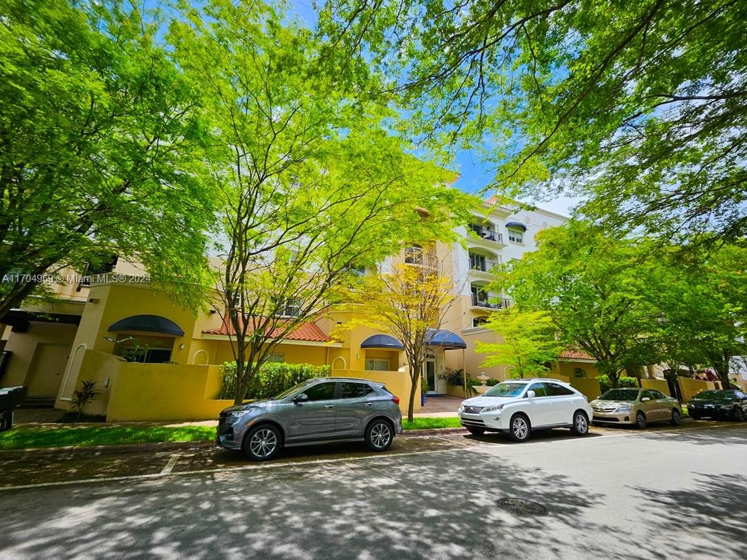 a view of a cars parked in front of a house