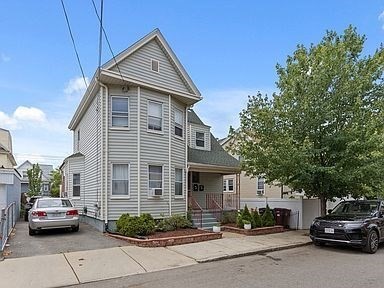 a car parked in front of a house