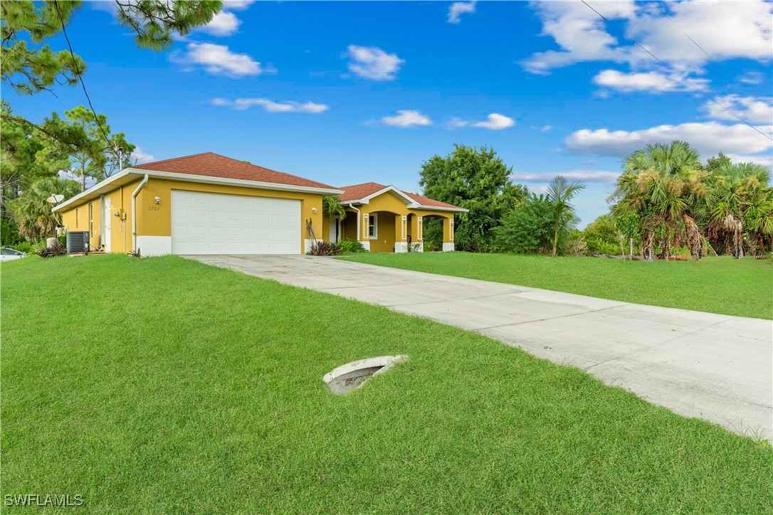 a view of a house with a yard