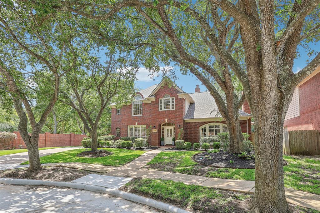 Main entrance of home with a view of long private driveway