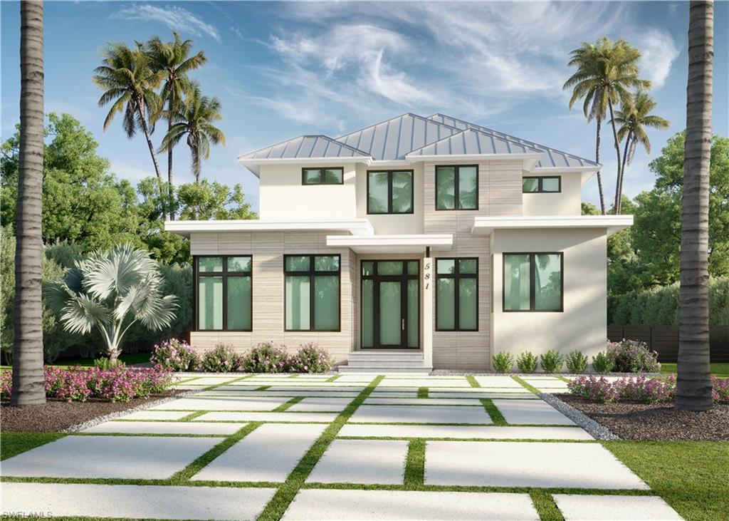 a front view of a house with a yard and palm tree