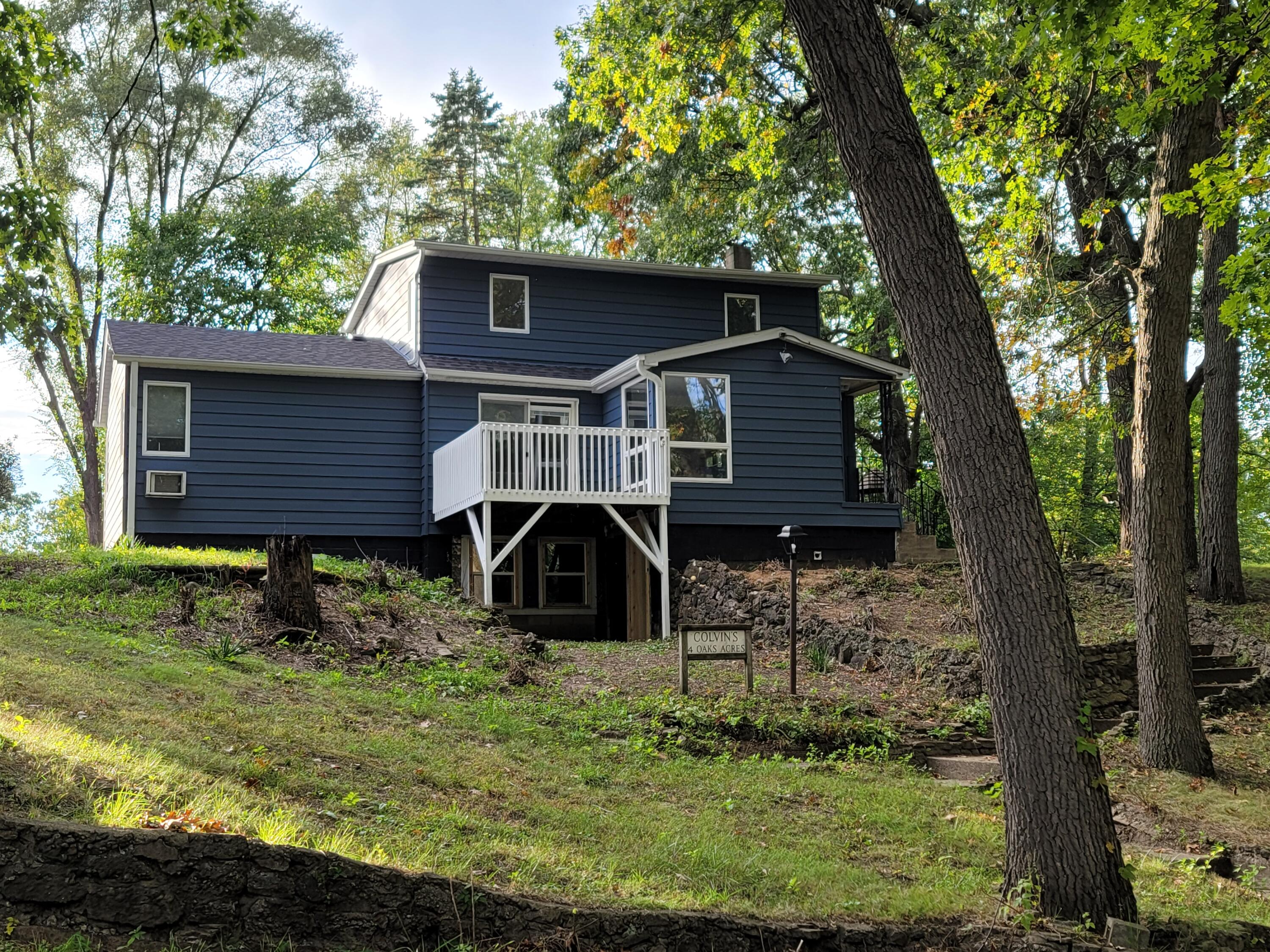 a view of house with a yard