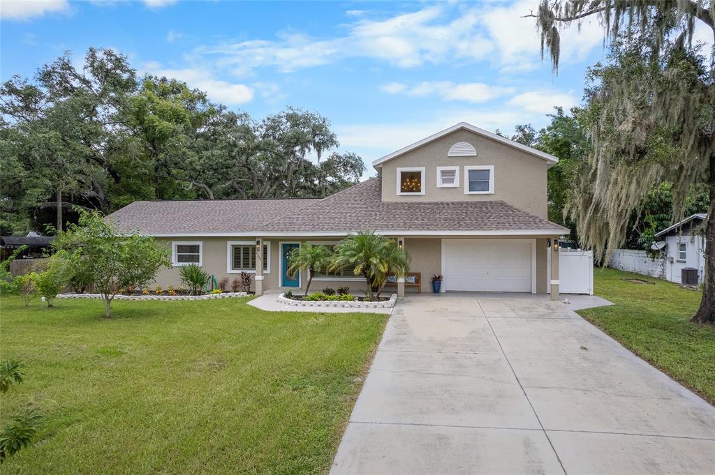 a front view of a house with yard