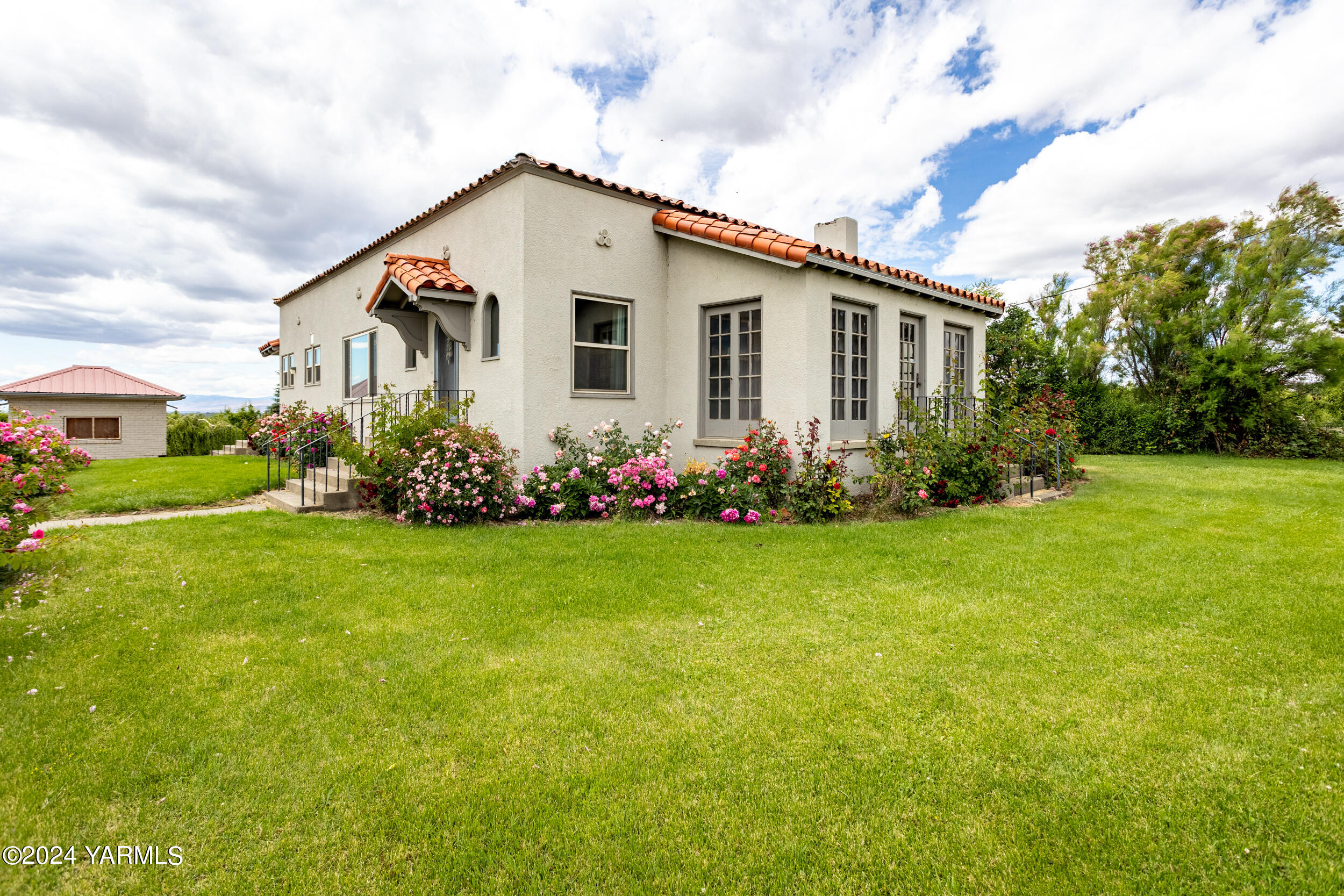 a front view of house with garden