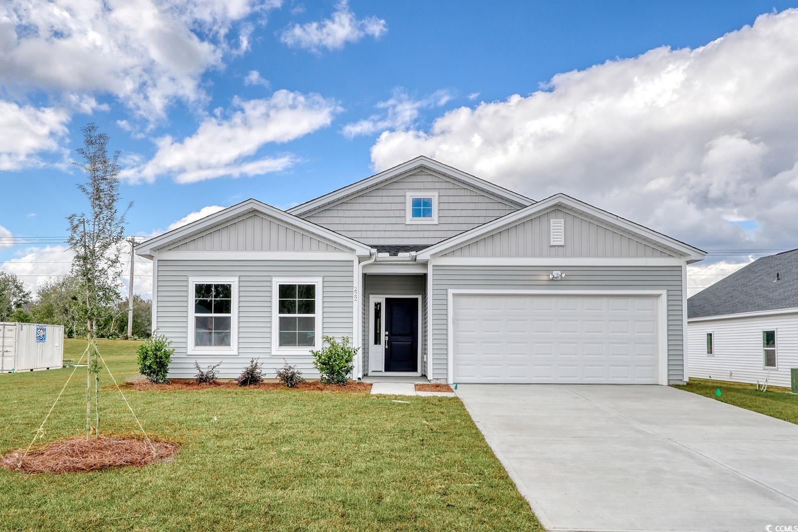 View of front of property featuring a front yard a