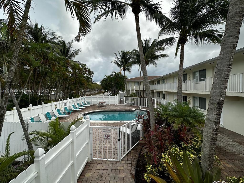 a view of a swimming pool with a patio