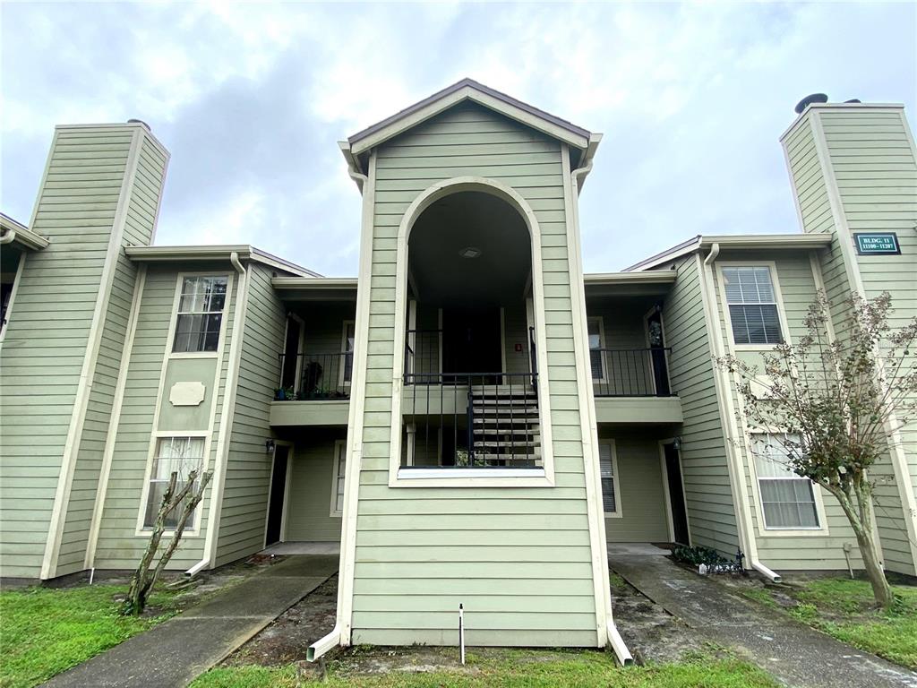 a view of a house with a door and a large window