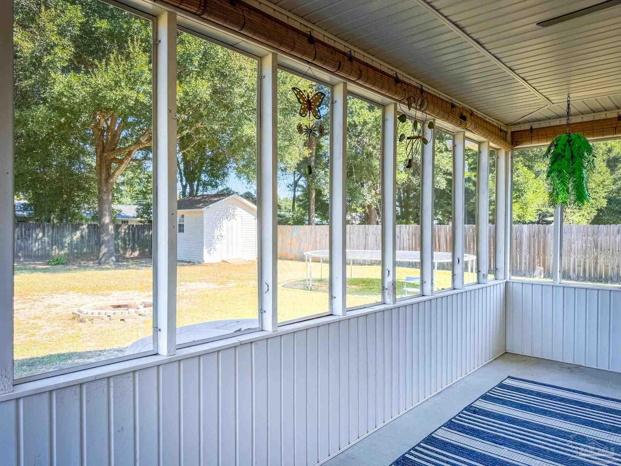 a view of a large window with wooden floor