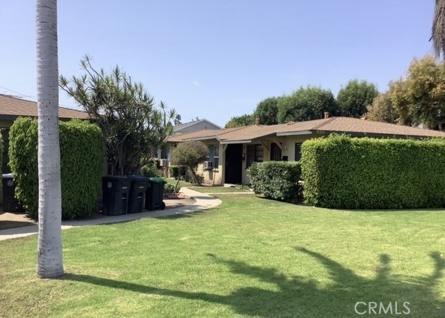 a view of a house with backyard porch and sitting area