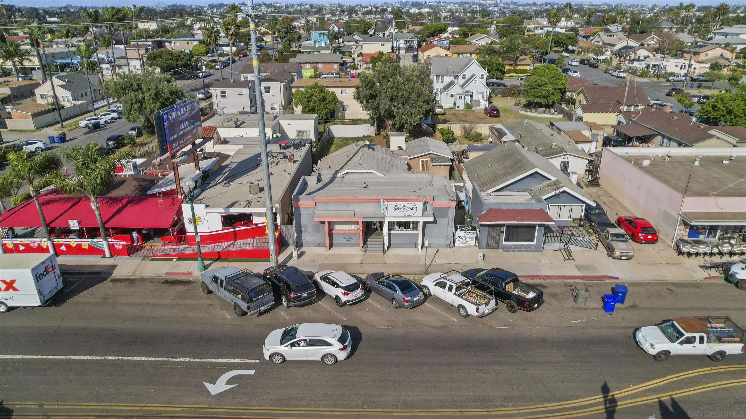 an aerial view of a and patio with lots of cars parked