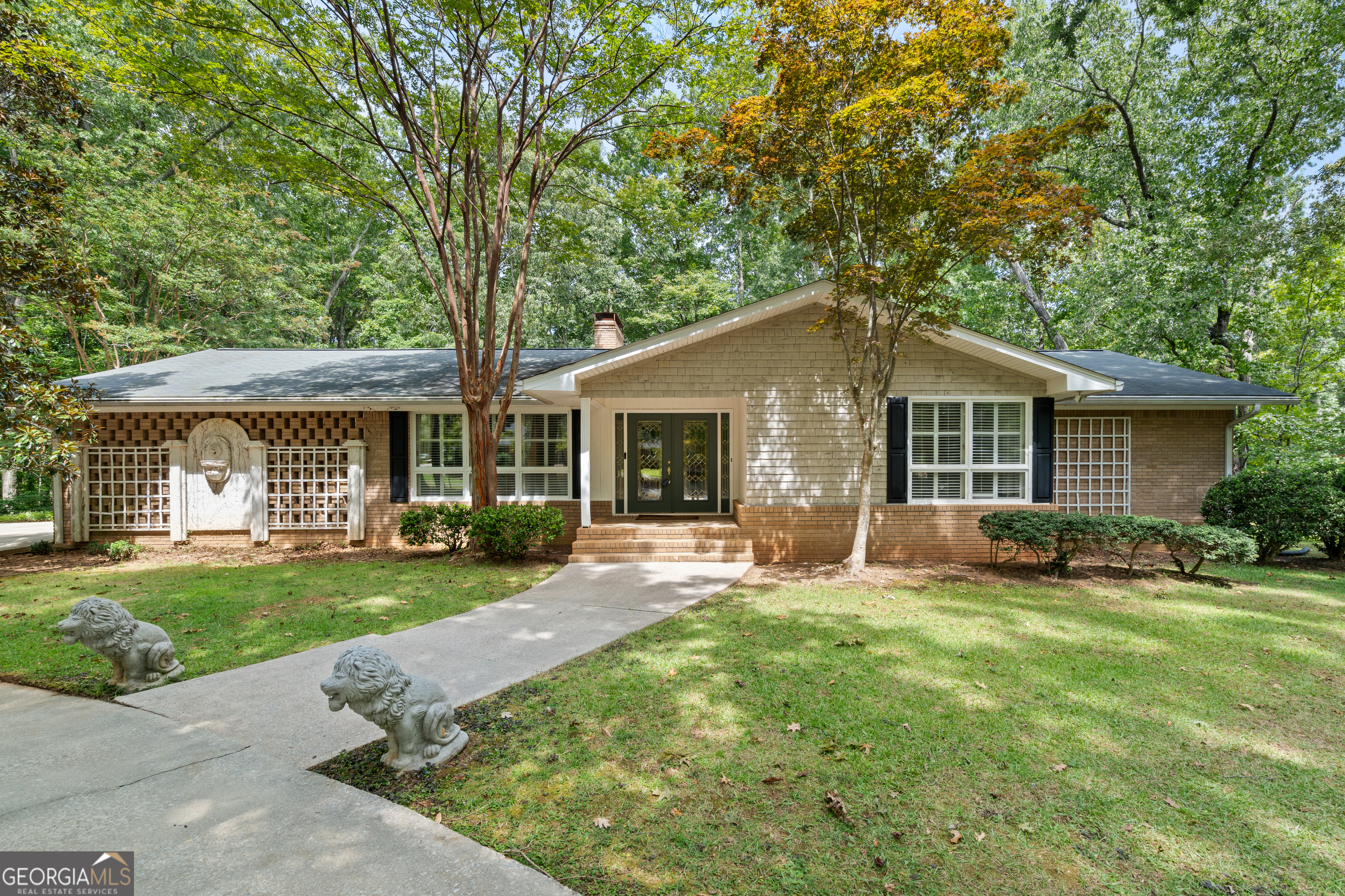 front view of a house with a yard