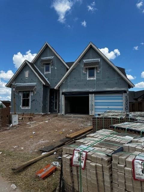 a front view of house with yard outdoor seating and garage