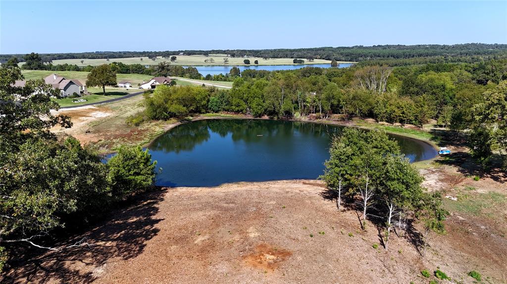 a view of a lake with a yard