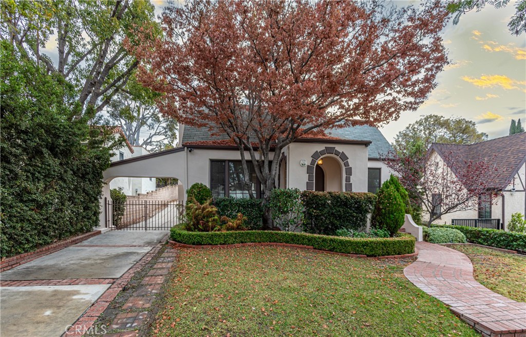 a front view of a house with garden