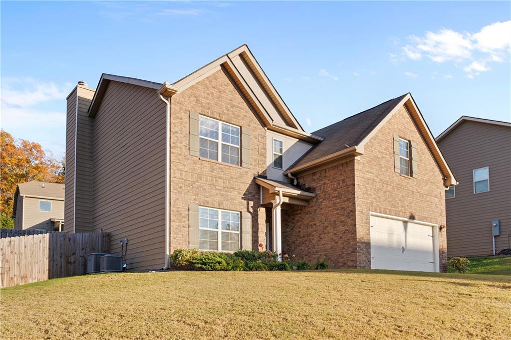 a front view of a house with a yard