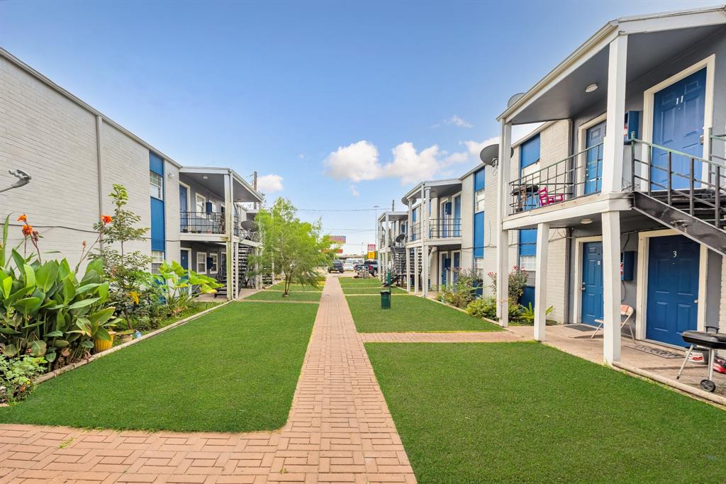 a view of a building with a yard