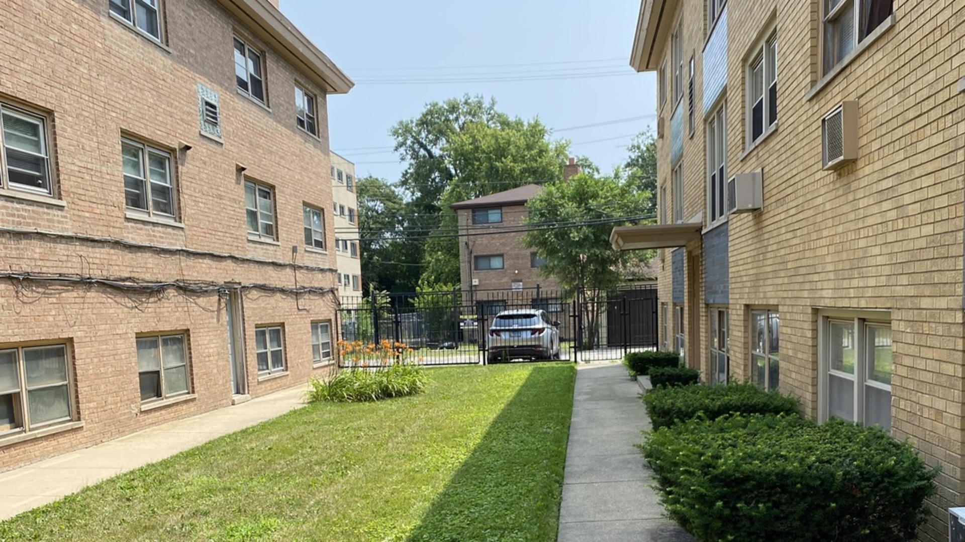 a view of a building with a yard