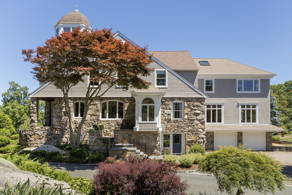 front view of a house with a garden