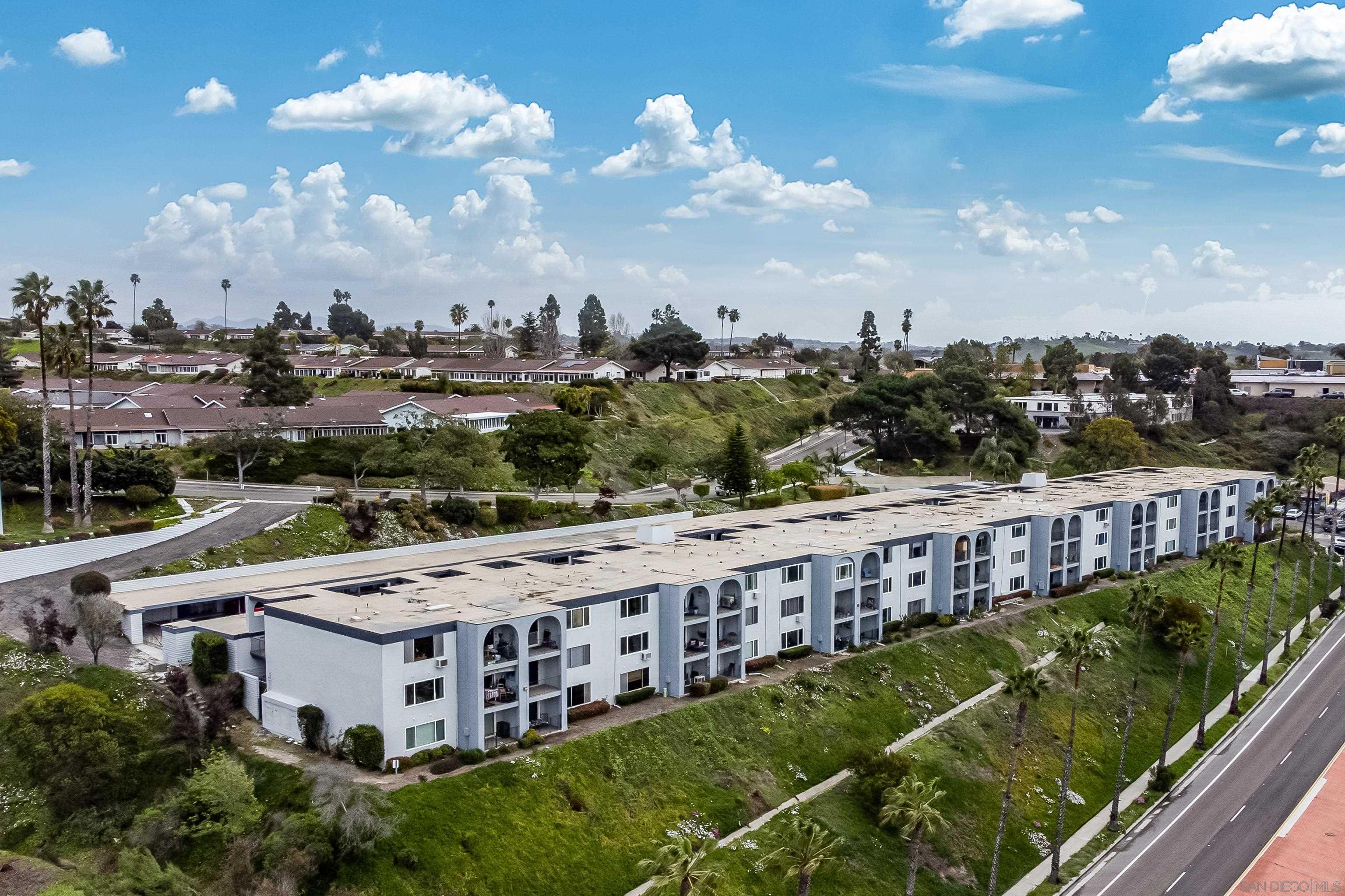 a view of a large building with a big yard