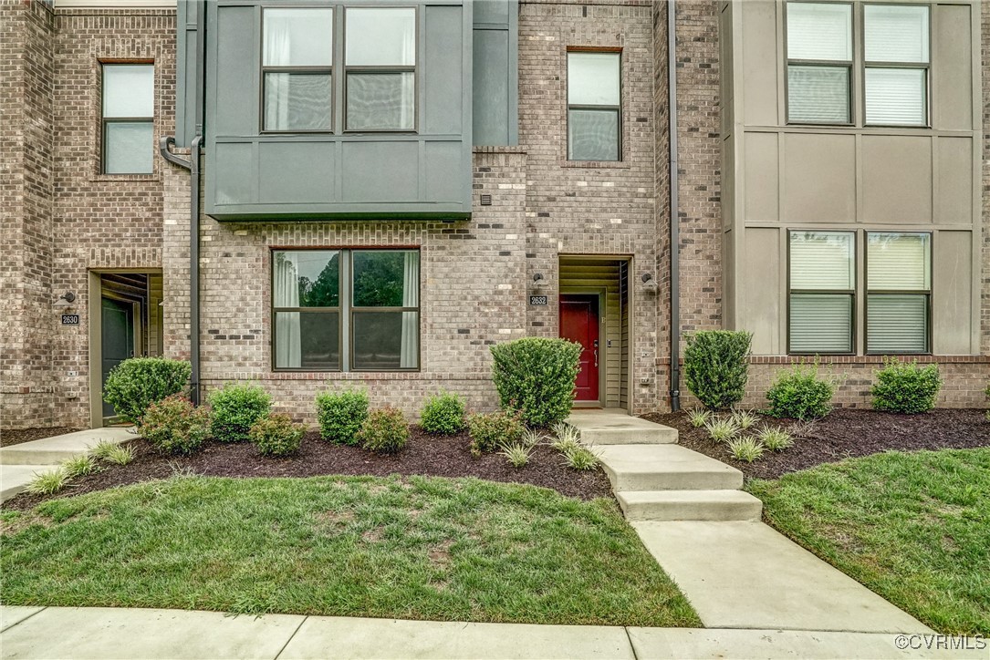 front view of a house with a yard