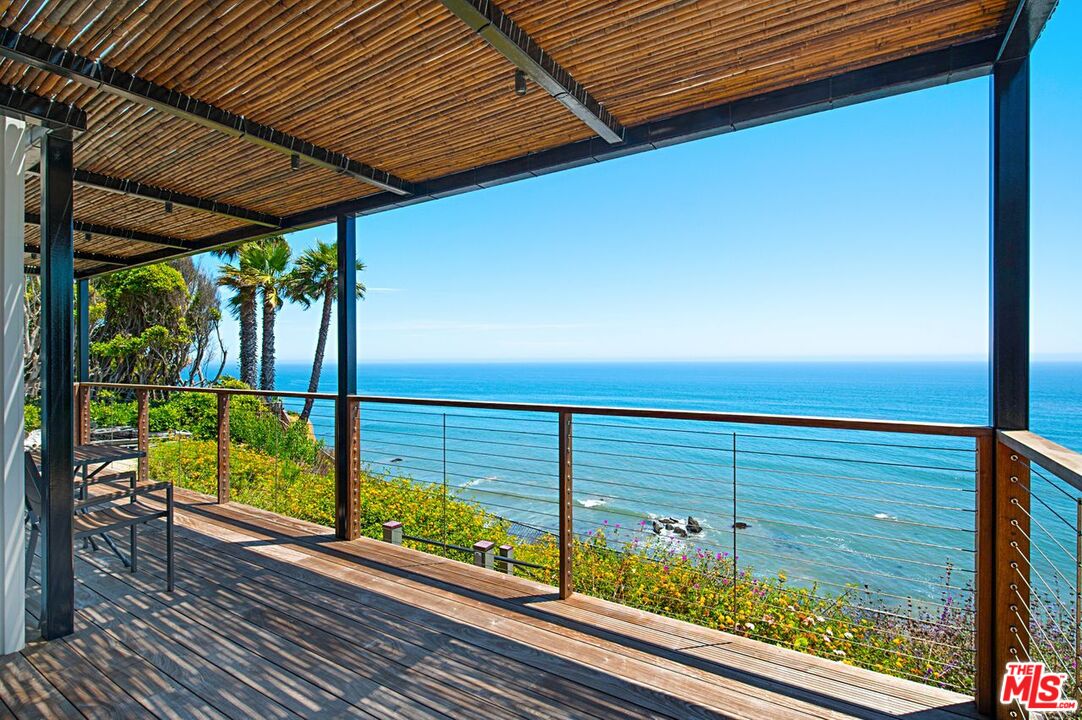 a view of a balcony with furniture