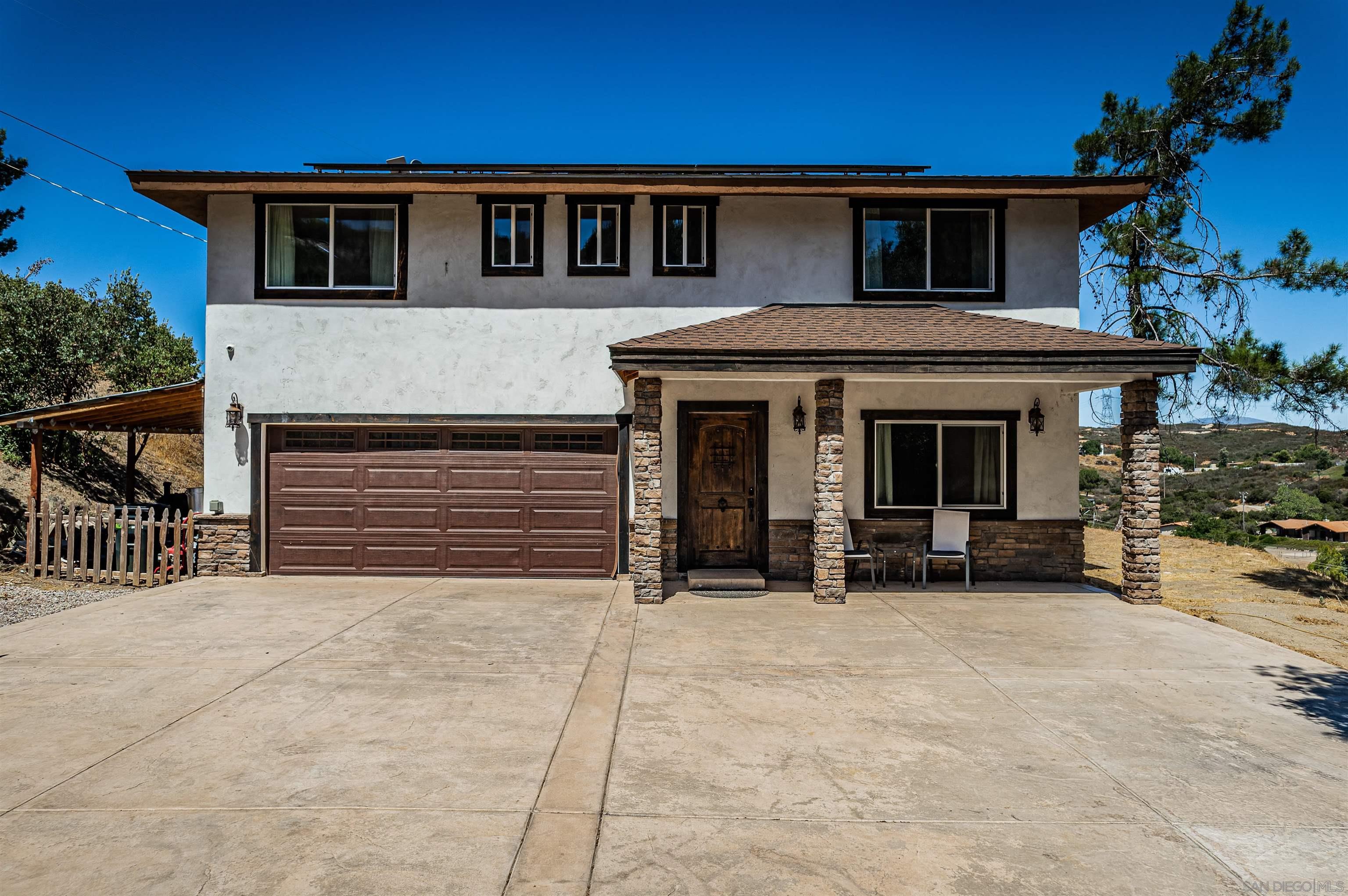 a front view of a house with a garage