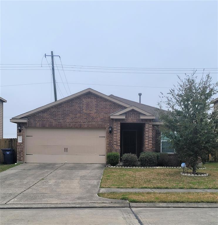 a front view of a house with garage